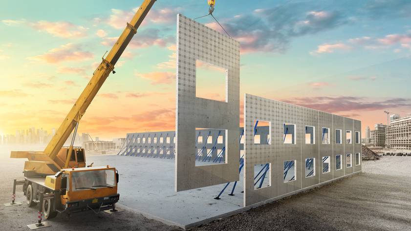 Crane lifting prefabricated wall panels